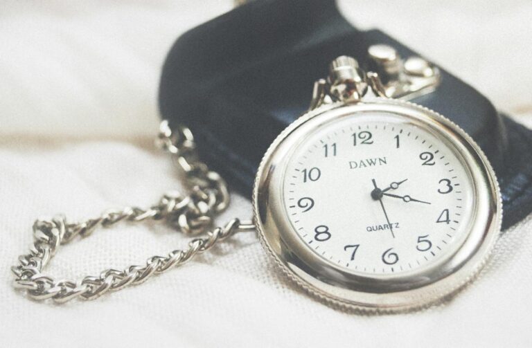 Round silver-colored Dawn analog pocket watch (Image credit: Christina Isabella christinaisabella, Unsplashed.)